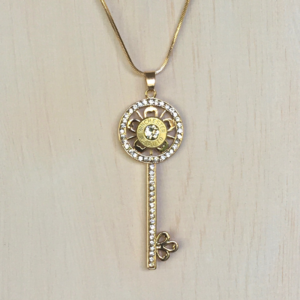 gold 45 caliber key necklace